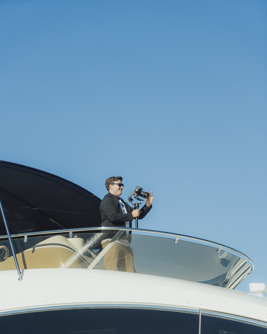 James, founder of Frames Media, filming from a flybridge