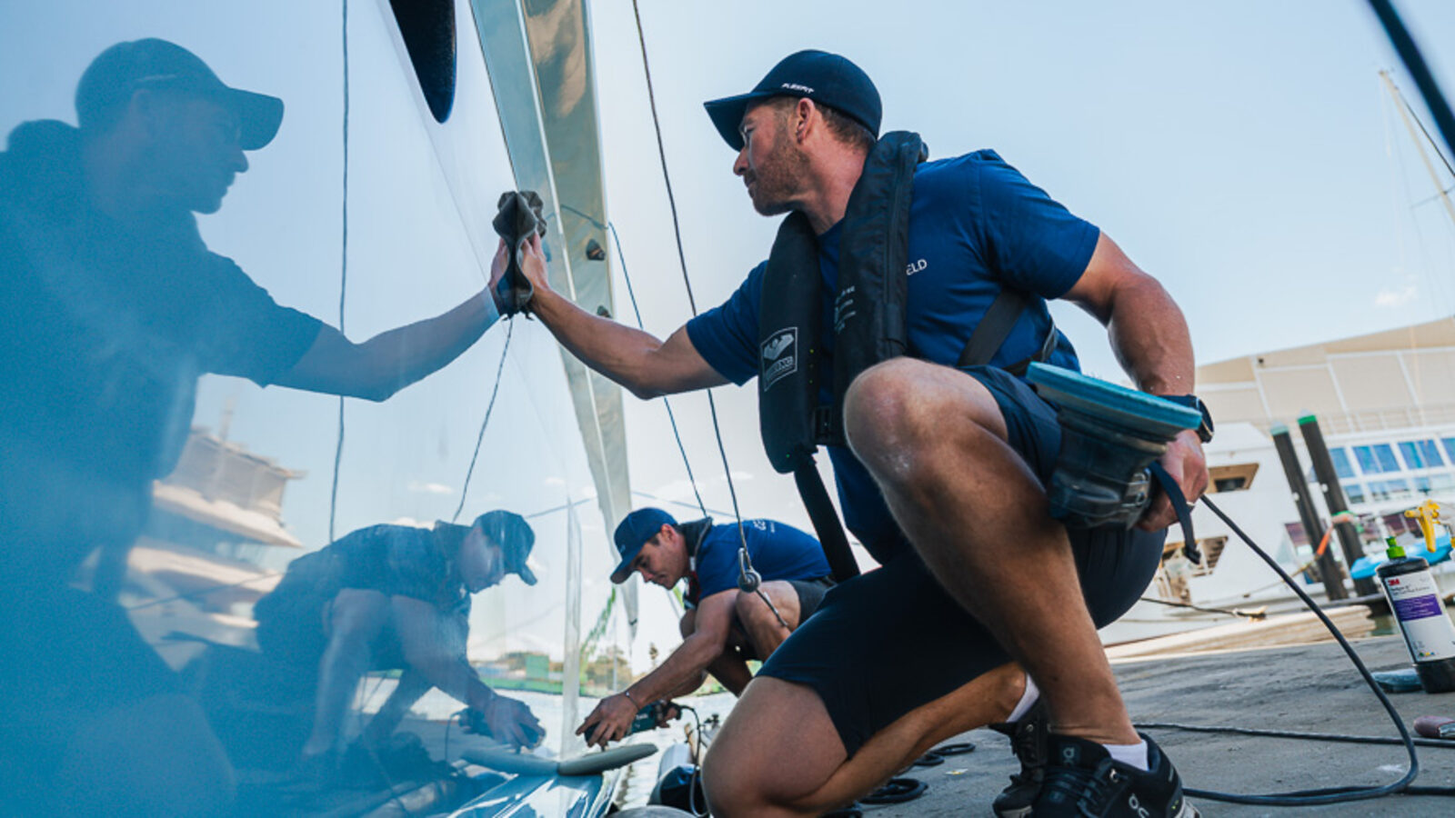 A marine trade crew working on a hull at a Gold Coast yard