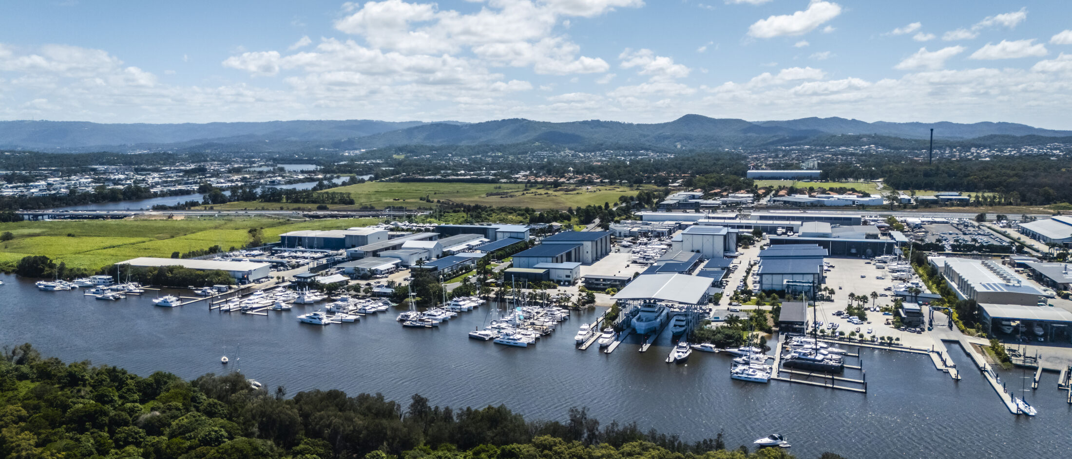 Aerial view of a Gold Coast marina and shipyard precinct